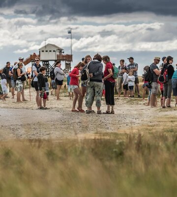 Gruppe von Menschen am Südstrand